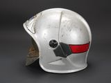 an old helmet with a red stripe on the side of it