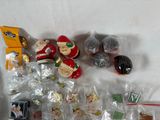 a lot of small christmas ornaments on the table