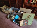 a pile of assorted items on the floor next to a bookcase