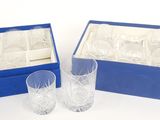 two glasses in a blue box and a glass in a blue box