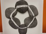 a black and white photo of rocks arranged in a circle