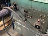 a machine that is sitting on the floor in the garage