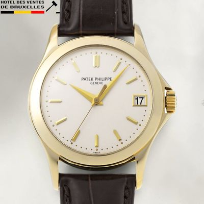 an image of a close up of a wrist watch with a white dial