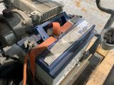 a small engine that is sitting on a pallet