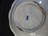 a white plate with a blue design on it