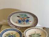 a tray with three plates and a bowl on it