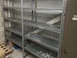 many shelves in a room with a lot of items