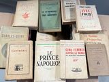 a lot of books that are sitting on top of a table