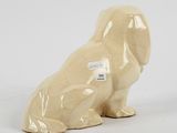 porcelain dog figurine in the shape of a dog with a tag on it ' s collar