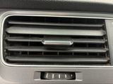 a close up of a air vent in a car