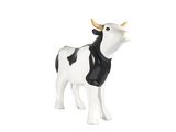 une figurine représentant une vache blanche et noire sur fond blanc