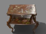 a small table with a bird design on it