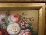 a picture of a painting of flowers in a gold frame