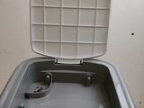 a washing machine that is sitting on top of a counter