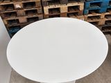 a white table with a white top in a room