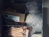 a cardboard box filled with toothpicks and other items