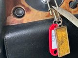 a key that is attached to the steering wheel of a car