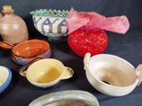 many different types of pottery on the table