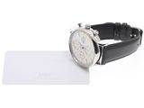 a watch that is sitting on top of a card
