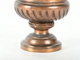 an image of a bronze vase on a white background