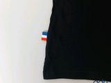 black t - shirt with a red, white, and blue stripe on it
