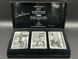 three cards in a case with a picture of a man and a woman