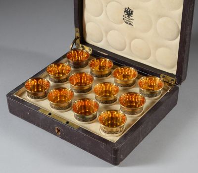 an open box with a set of twelve glass cups in it
