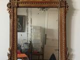 a mirror hanging on the wall in a room