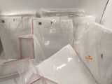 many pieces of plastic wrapped up in a room