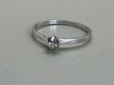 an image of a diamond ring on a table