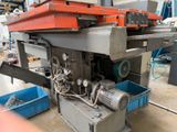 a machine that is working on a piece of metal