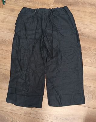 the shorts are black and have a zipper on the side