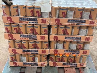 several cans of beer are stacked on top of a pallet