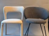 three chairs sitting next to each other in a room