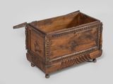 an old wooden box sitting on top of a white surface
