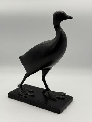 sculpture of a black bird on a black base