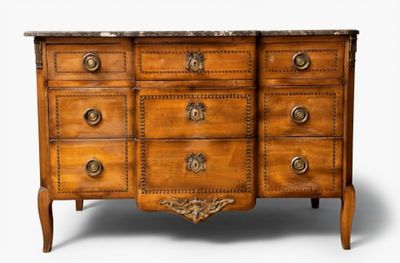 a wooden chest of drawers with a marble top