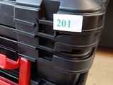 a stack of black and red plastic boxes on a table