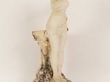 an image of a statue of a woman standing on a marble base