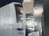 boxed box of a toaster sitting on a table with a piece of paper taped to it