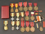 many medals and medals laid out on a table