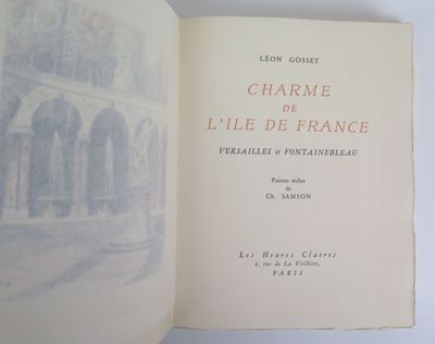 an open book with a picture of a building in the background