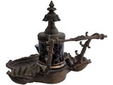 a statue of a boat with a statue of a man on it