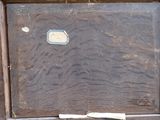 an old wooden box with a label on it