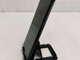 a cell phone that is on a stand on a table