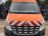 an orange van is parked in a lot with other vehicles