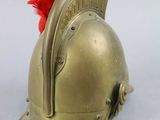 helmet of a roman soldier with a red mohawk on it
