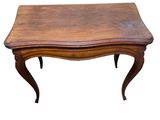 an old wooden table with a wooden top and legs