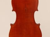 an old violin with a wooden back and a long neck
