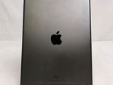 a close up of the back of an ipad with a black apple logo on it